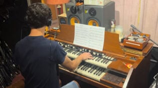 Live music session for New Orleans Pelicans sonic brand theme, a musician playing a Hammond B3 organ.